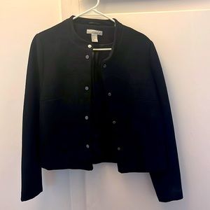 Thick black Womens blazer. Lined inside, buttons down the front.